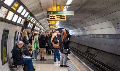 Passengers waiting at an underground station. 