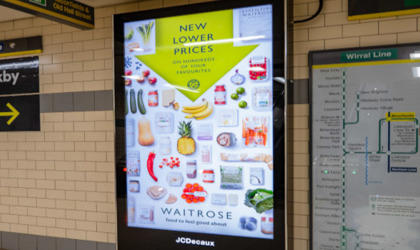 A digital advertising screen at a station. 